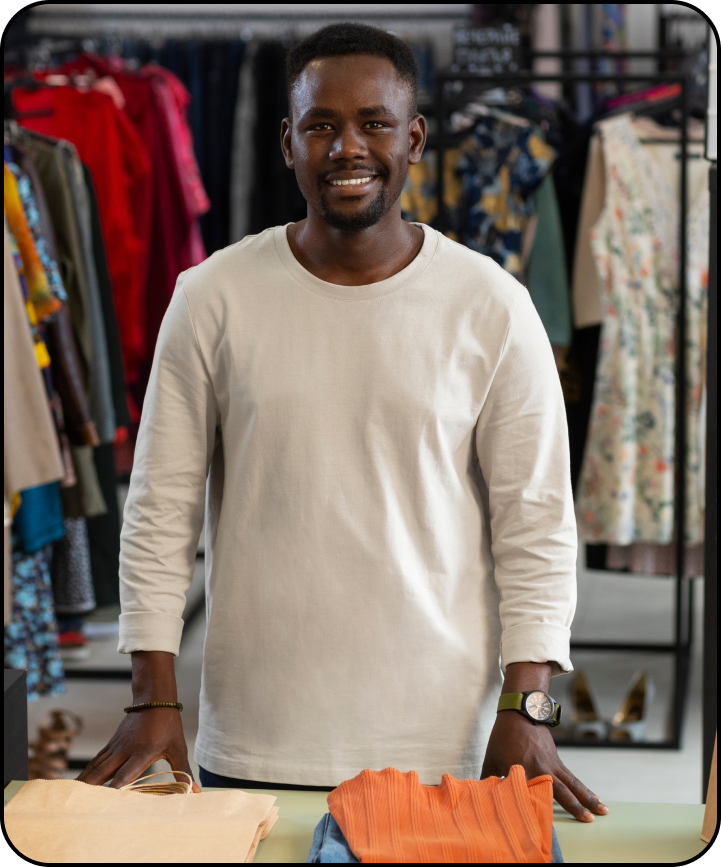 Happy man shopping in clothing store